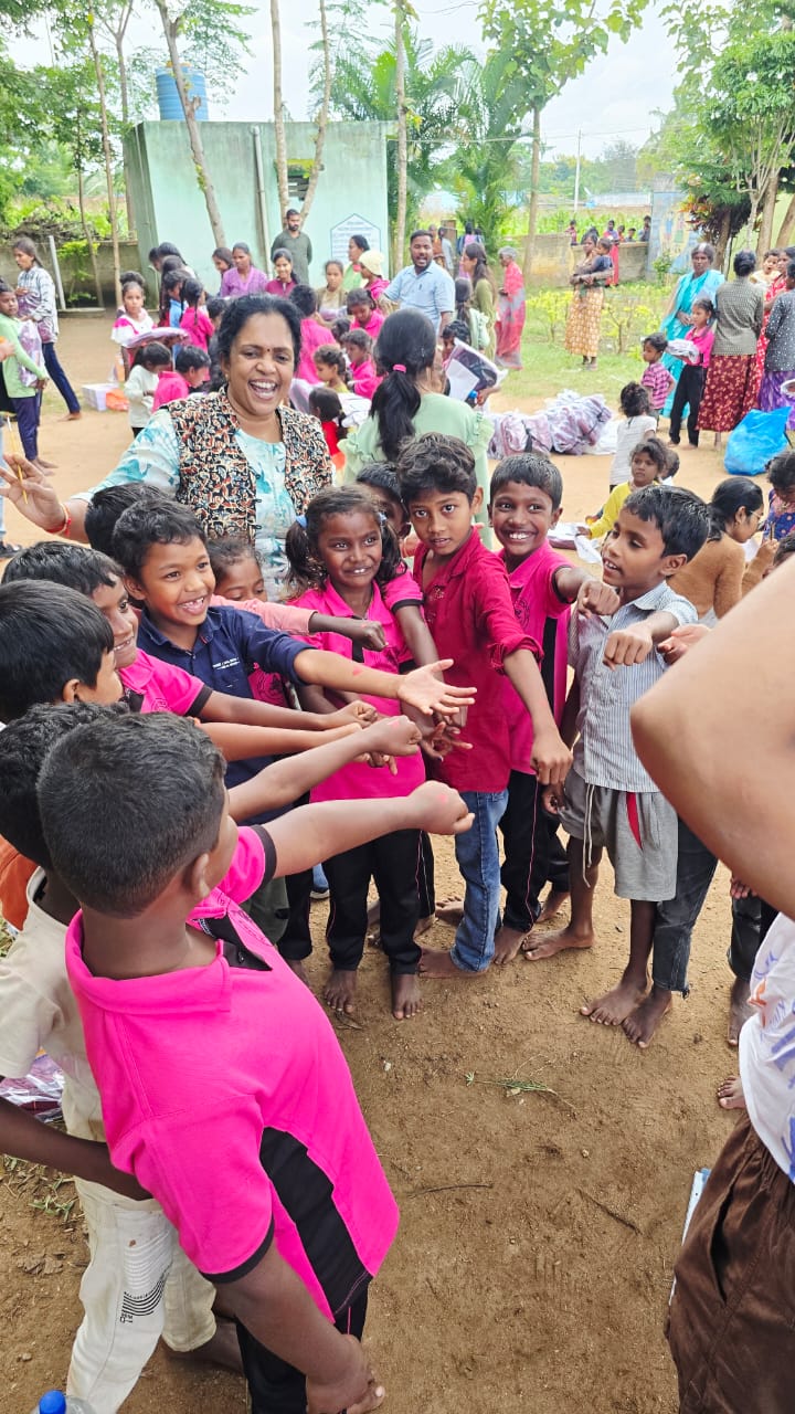 Children reaching for distributed supplies
