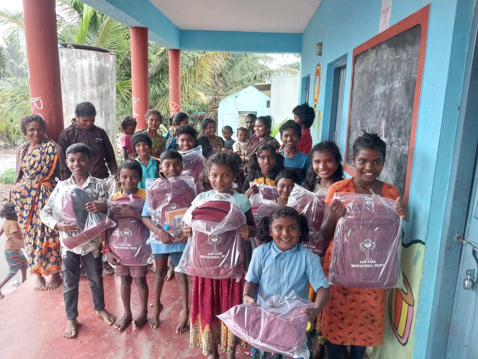Children with school bags on a veranda